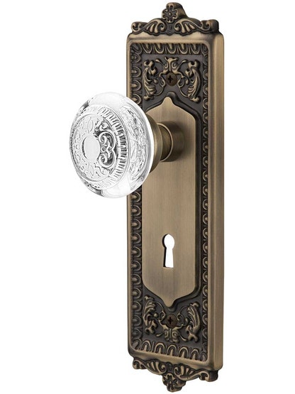 Egg and Dart Mortise-Lock Set with Matching Crystal-Glass Knobs in Antique Brass.